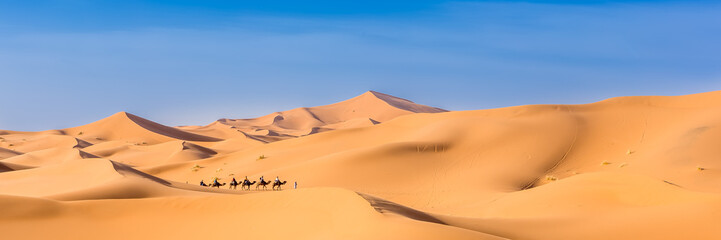 Merzouga in the Sahara Desert in Morocco. Web banner in panoramic view.