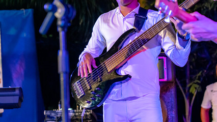 Obraz na płótnie Canvas Cuban musician playing guitar on the stage, Havana, Cuba.