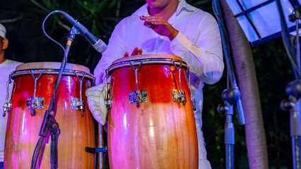 Fototapeta na wymiar Cuban musician playing drums on the stage, Havana, Cuba.