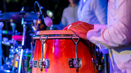 Cuban musician playing drums on the stage, Havana, Cuba.