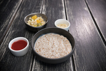 Delicious porridge with fresh fruits and natural sauces