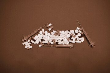 pills ampoules scattered on the background together with wooden cubes, health concept without pills
