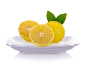 Lemons  on plate isolated on white background.