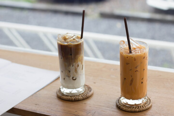 Thai tea with coffee shop background