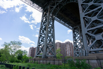 Fototapeta premium View of bridge from below. Williamsburg bridge with view of Lower East Side Public Housing