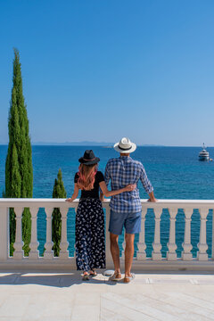 Young couple enjoying the view from a luxury villa in Croatia, Europe 