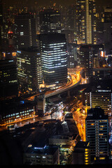 Fototapeta na wymiar Night view of skyscrapers in Osaka, Japan