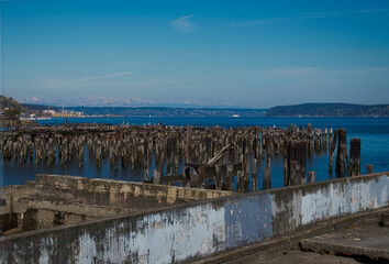 2020-06-01 DECAYING PILINGS AND WALL OF A OLD BUILDING BY THE PUGET SOUND NEAR RUTON WAY WITH THE...