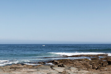 Fototapeta na wymiar Isolated fishing boat in open water off the Australian coastline.