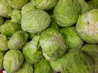 Fototapeta na wymiar Cabbage background. Cabbages in the supermarket. Vegetable food in the supermarket. Health food