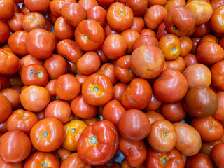 Tomatoes background.  Red tomatoes texture. Fresh food. Good nutrition. Vegetables and fruits in the supermarket