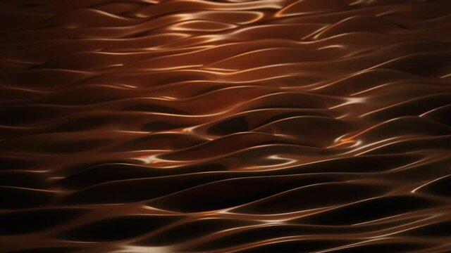 Silky smooth chocolate milk background video. Seamless looping cocoa butter animation. Depth of field bokeh blur. Golden brown creamy baking backdrop.