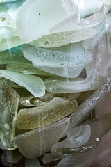 Sea Glass Mosaic, patterns made from Ocean glass, its a lifestyle background made with natural colours of blue, green, brown and white, hand made feeling like handcraft.