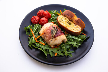 Chicken breasts filled with creamy parmigiana stuffing and wrapped in prosciutto