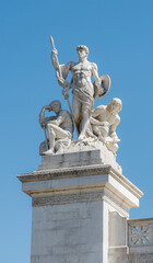 Fototapeta na wymiar sculpture The Force near Victor Emmanuel II National Monument in Rome. Man with a spear and shield