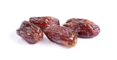 Medjool dried date palm fruits isolated on a white background.