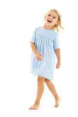Charming little girl laughing happily in studio
