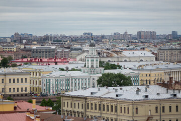 Fototapeta na wymiar View on Saint Petersburgs' roofs from a cathedral height. Saint Petersburg in different directions. Kunstkamera