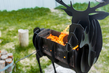 A barbecue grill in the shape of deer antlers. © Olga Gimaeva