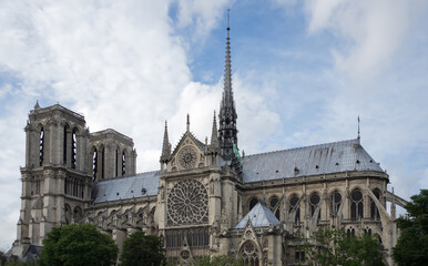 Fototapeta na wymiar Notre Dame de Paris in a beautiful summer day. Side shots on the church.