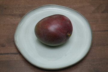 red mango on a plate