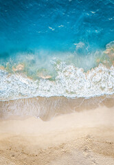 Fototapeta na wymiar Top view of beautiful white sand beach with turquoise ocean water, aerial drone shot