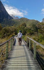 A Man standing at Milford Sound South Island New Zealand