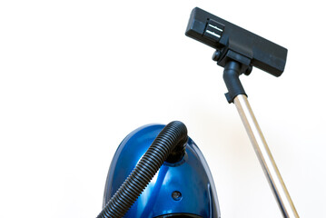 Cleaning concept - vacuum cleaner on white background close up