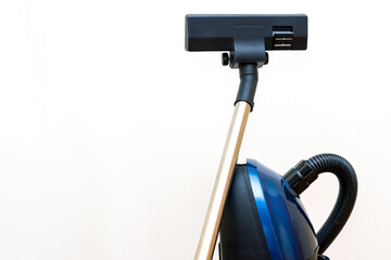 Cleaning concept - vacuum cleaner on white background close up