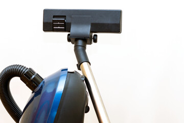 Cleaning concept - vacuum cleaner on white background close up