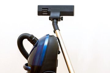 Cleaning concept - vacuum cleaner on white background close up
