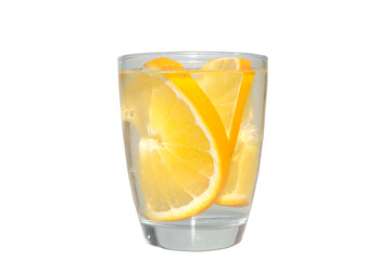 Clear liquid in clear glass with orange pieces inside isolated on white background