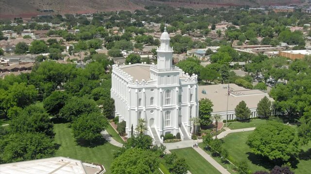 Aerial: flying over suburbs and St George Utah Temple. Utah, USA