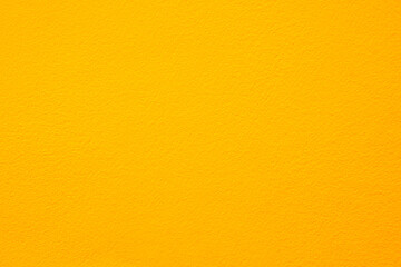 Fototapeta premium Yellow color concrete wall. Design and painting for colorful style. 