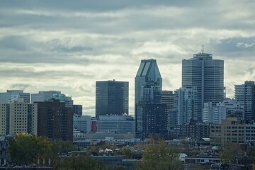 Close view of a few sky scrapers of Montreal's down town from a distance of Plateau district from high floor