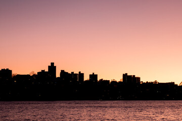 Fototapeta na wymiar apartments by sydney harbour in dawn silhouette