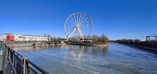 ferris wheel of Montreal with frozen pond around it