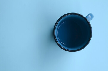 blue mug mock-up on blue background. empty space