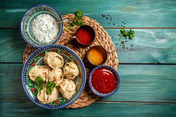Homemade Uzbek dish boiled Manti or manty. Chuchvara dumpling typical of Central Asian cuisine, Traditional Uzbek oriental cuisine. top view