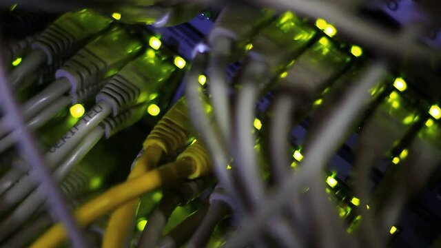 Working Ethernet switch close up. Blinking LED. 10/100/1000 Mpbs speed. Fully loaded and working fast. Top technology clip.