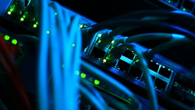 Working Ethernet switch close up. Blinking LED. 10/100/1000 Mpbs speed. Fully loaded and working fast. Top technology clip.