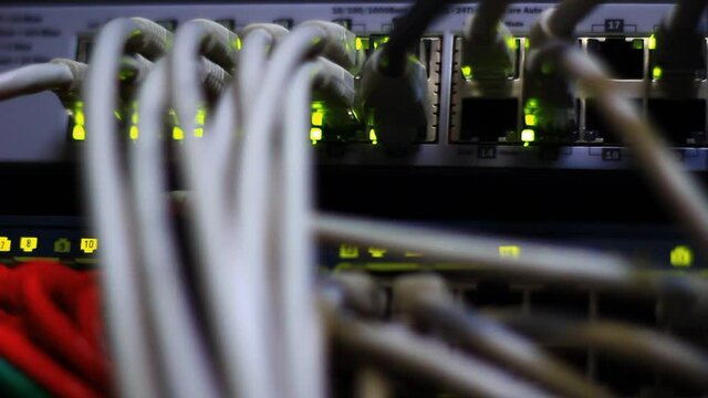 Working Ethernet switch close up. Blinking LED. 10/100/1000 Mpbs speed. Fully loaded and working fast. Top technology clip.