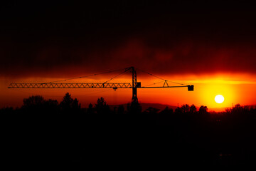 silhouette crane construction site on sunset time background