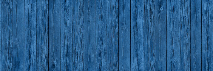 old blue wooden fence with peeling paint