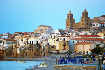 City beach of Cefalu, with the cathedral, Sicily