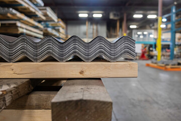 A stack of corrugated roofing sheets on wooden pallet for delivery