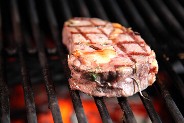Preparation of steak on the grate and coals. Chef making steak. Beef tender steak on the grill.