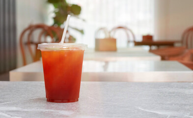 glass of ice tea on cafe table
