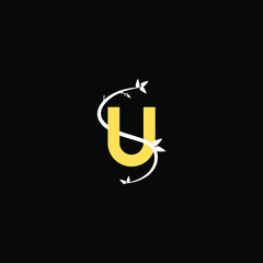 Modern flourish letter U monogram logo with gold color