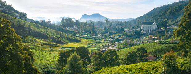 Beautiful panoramic view of mountain town of Nuwara Eliya among tea plantations in mountains island Sri Lanka. - 355097576